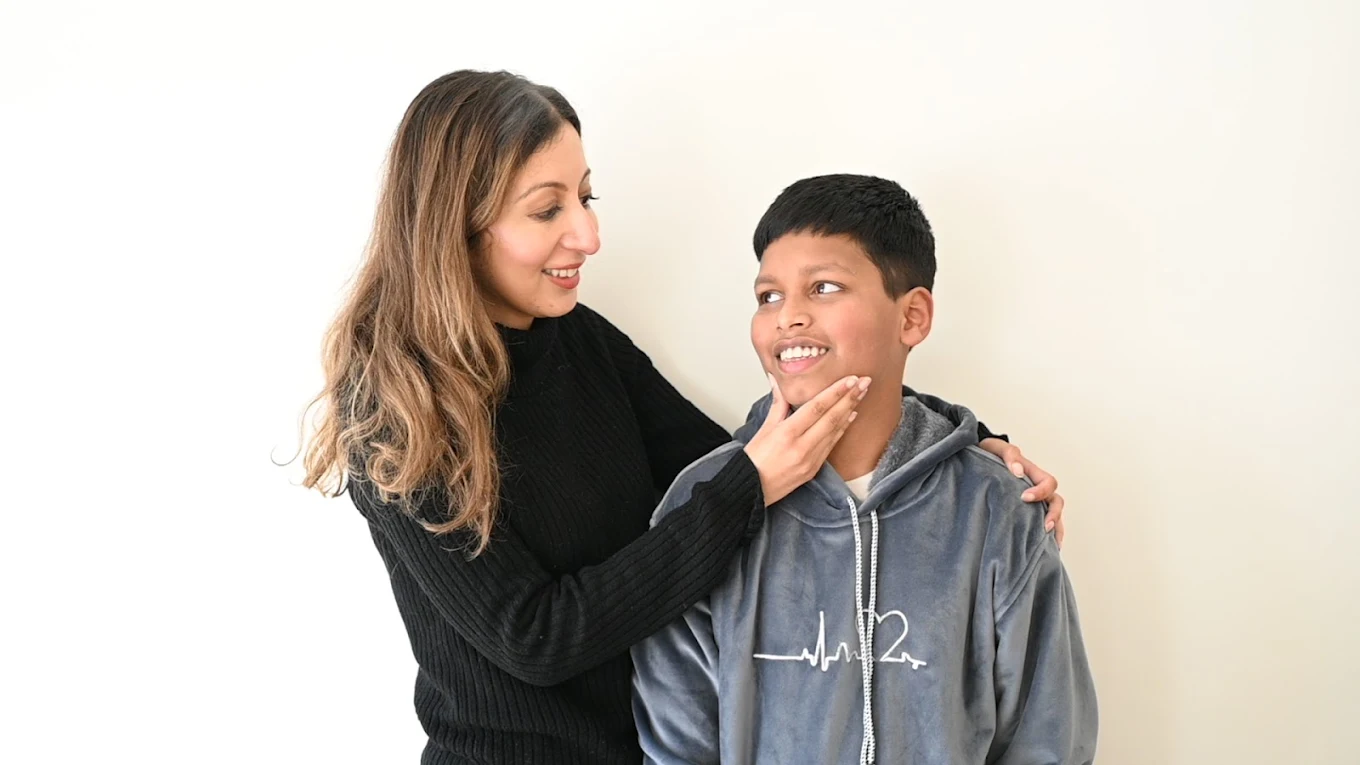 Dr. Niyukty Arjal smiling with a child patient at Gums & Giggles Dental Clinic
